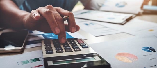 A person using a calculator